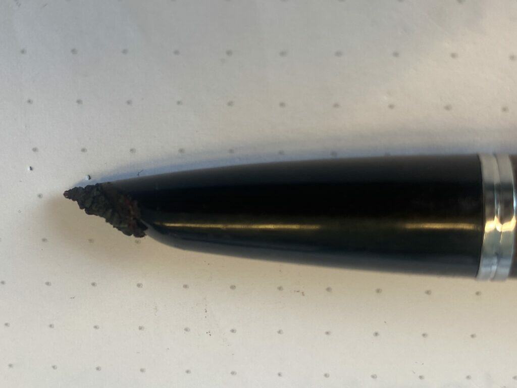 dried-up residue of ink on a fountain pen nib
